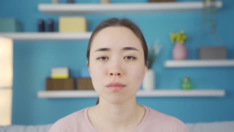 Close-up-of-depressed-Asian-young-woman.